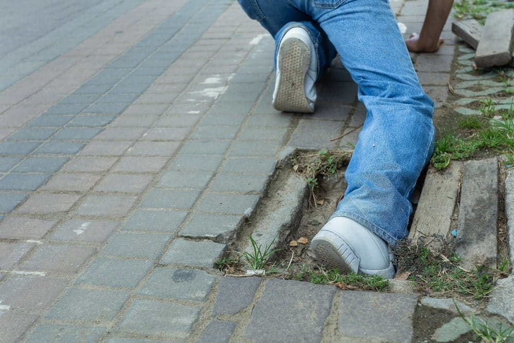 Who Is Liable for Injuries Caused by a Broken Sidewalk